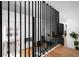 Living room with a view through a modern railing, showcasing an open floor plan and sleek design elements at 5401 E Dakota Ave # 3, Denver, CO 80246