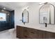 Bathroom featuring a double vanity, and a glass-enclosed tiled shower at 3430 W 25Th Ave, Denver, CO 80211