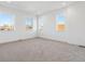 Bright bedroom with neutral carpet, white walls and a trim and lots of natural light at 3430 W 25Th Ave, Denver, CO 80211