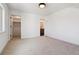 Neutral bedroom with an ensuite bathroom and a walk-in closet at 3430 W 25Th Ave, Denver, CO 80211