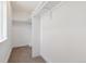 A walk-in closet with ample storage space, shelving, and carpeting at 3430 W 25Th Ave, Denver, CO 80211