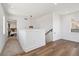 Hallway with wood floors, neutral walls and access to a bedroom space at 3430 W 25Th Ave, Denver, CO 80211