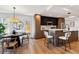 Open-concept layout with kitchen island and dining area, perfect for entertaining at 3430 W 25Th Ave, Denver, CO 80211