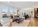 Well-lit living room boasts lots of natural light with the dining area visible from the living room at 3430 W 25Th Ave, Denver, CO 80211