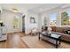 Cozy living room featuring natural light, hardwood floors, and stylish furnishings at 3430 W 25Th Ave, Denver, CO 80211
