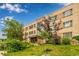 Brick apartment building exterior with lawn and landscaping, offering classic charm at 1450 Albion St # 204, Denver, CO 80220