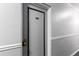 Apartment hallway with gray textured walls and door 204 at 1450 Albion St # 204, Denver, CO 80220