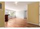 Bright living room with hardwood flooring, stylish lights, and neutral wall colors at 1450 Albion St # 204, Denver, CO 80220
