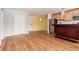 Bright living space with hardwood floors, bar area, and stainless steel appliances at 1450 Albion St # 204, Denver, CO 80220
