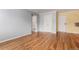 Hardwood floors and neutral paint throughout a spacious open living space at 1450 Albion St # 204, Denver, CO 80220