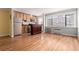 Open-concept living area featuring hardwood floors and stainless steel appliances at 1450 Albion St # 204, Denver, CO 80220