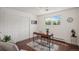 Spare bedroom or office featuring a desk, wood floors, and a large closet at 64 Nome Way # A, Aurora, CO 80012