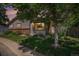 Charming single story home with a well-manicured lawn, mature trees, and a welcoming front entrance at 64 Nome Way # A, Aurora, CO 80012