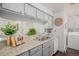 Kitchen with gray cabinets, granite countertops, and modern appliances at 64 Nome Way # A, Aurora, CO 80012