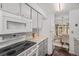 Clean, bright kitchen with stainless steel appliances and a breakfast bar open to the dining area at 64 Nome Way # A, Aurora, CO 80012