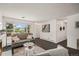 Cozy living room with hardwood floors, neutral colors, and plenty of natural light at 64 Nome Way # A, Aurora, CO 80012