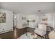 Open concept living room with hardwood floors and ample natural light at 64 Nome Way # A, Aurora, CO 80012