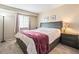 Comfortable bedroom features a spacious closet, neutral walls, and a cozy atmosphere for restful nights at 9314 Wiltshire Dr, Highlands Ranch, CO 80130