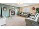 Cozy living room showcasing a brick fireplace, complemented by comfortable seating and warm, inviting colors at 9314 Wiltshire Dr, Highlands Ranch, CO 80130