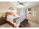 Relaxing main bedroom features a vaulted ceiling, a ceiling fan, and a large window for natural light at 9314 Wiltshire Dr, Highlands Ranch, CO 80130