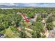 Aerial view of a property with a large yard, mature trees, and a peaceful, green neighborhood at 9146 W 89Th Ct, Broomfield, CO 80021