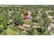 Aerial shot of a property with a creek running along a fenced yard surrounded by lush greenery at 9146 W 89Th Ct, Broomfield, CO 80021