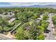 Aerial view of property showcasing proximity to a creek, green spaces, and neighborhood amenities at 9146 W 89Th Ct, Broomfield, CO 80021