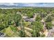 Stunning aerial view of the property, highlighting its proximity to a serene lake and abundant greenery at 9146 W 89Th Ct, Broomfield, CO 80021
