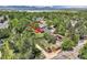 Aerial view of a property with a spacious backyard bordering a creek and green space at 9146 W 89Th Ct, Broomfield, CO 80021
