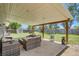 Covered patio perfect for outdoor entertaining in a spacious fenced backyard with shed at 9146 W 89Th Ct, Broomfield, CO 80021