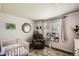 Inviting Bedroom featuring a crib, rocking chair, and decorative accents at 9146 W 89Th Ct, Broomfield, CO 80021