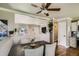 Dining area adjacent to the kitchen featuring a wood table and hardwood floors at 9146 W 89Th Ct, Broomfield, CO 80021