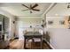 Charming dining area with hardwood floors and modern ceiling fan for a cozy meal at 9146 W 89Th Ct, Broomfield, CO 80021