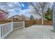Fenced backyard featuring a wood deck and a fire pit behind the deck at 16780 E Hialeah Ave, Centennial, CO 80015