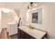 Laundry room featuring a vanity with a mirror and a laundry machine on the left side at 16780 E Hialeah Ave, Centennial, CO 80015
