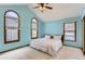 Spacious bedroom with vaulted ceilings, natural lighting, and a neutral color scheme at 16780 E Hialeah Ave, Centennial, CO 80015