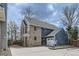 Two-story home featuring brick and blue siding, an attached garage, and a well-maintained front yard at 16780 E Hialeah Ave, Centennial, CO 80015