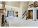 Bright living room featuring vaulted ceilings, a fireplace, and sliding glass doors to the exterior at 16780 E Hialeah Ave, Centennial, CO 80015