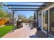 Outdoor deck with a pergola, dining table, and grill, perfect for entertaining guests at 4071 E 126Th Pl, Thornton, CO 80241