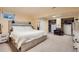 Basement bedroom boasts carpeted floors and a walk-in closet at 4071 E 126Th Pl, Thornton, CO 80241