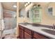 Bathroom boasts double sinks, walk-in shower, and storage at 4071 E 126Th Pl, Thornton, CO 80241