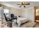 Bedroom boasts plush carpeting, closet, and adjacent bathroom at 4071 E 126Th Pl, Thornton, CO 80241