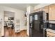 Kitchen is adjacent to the dining and living room at 4071 E 126Th Pl, Thornton, CO 80241