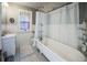 Classic bathroom with clawfoot tub and subway tile at 1351 N Franklin St, Denver, CO 80218