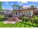 Beautiful backyard deck with pergola, outdoor furniture, and landscaped yard, creating a relaxing outdoor space at 4059 Nevis St, Boulder, CO 80301