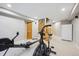 Finished basement with workout area, open staircase, and neutral color palette at 4059 Nevis St, Boulder, CO 80301