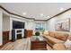 Finished basement offers a relaxation area with a large sofa and wood-style floors at 4059 Nevis St, Boulder, CO 80301