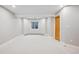 Spacious finished basement with large window and neutral color palette at 4059 Nevis St, Boulder, CO 80301