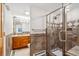 Updated bathroom featuring glass enclosed shower, wood vanity, and designer tile at 4059 Nevis St, Boulder, CO 80301