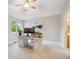 Cozy bedroom with a desk, large monitor, and views of nature from the bright window at 4059 Nevis St, Boulder, CO 80301